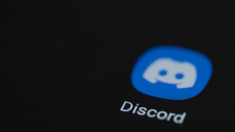 Close-Up-Shot-of-Finger-Tapping-the-Discord-On-a-Smartphone-Screen