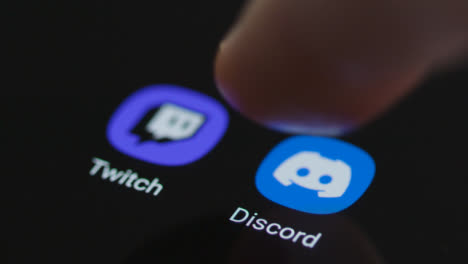 Close-Up-Shot-of-Finger-Tapping-On-Discord-On-Smartphone-