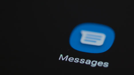 Close-Up-Shot-of-a-Finger-Tapping-the-Messages-App-On-Smartphone-Screen
