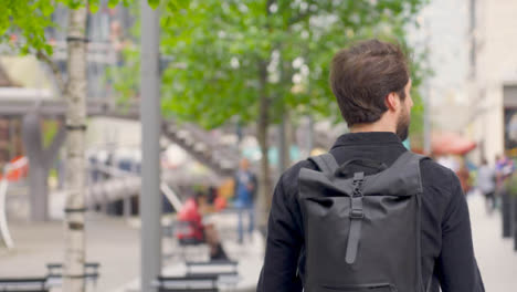 Tracking-Shot-Following-Person-with-Backpack-Walking
