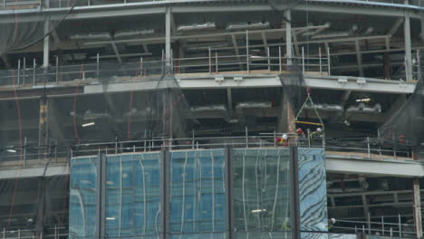 Long-Shot-of-Construction-Workers-Working-On-Building