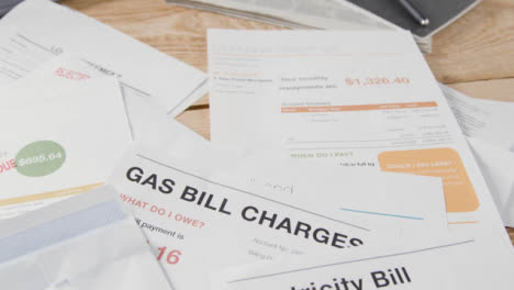 Close-Up-Of-Overdue-US-Utility-And-Service-Bills-On-Table-3