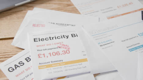 Close-Up-Of-Overdue-UK-Utility-And-Service-Bills-On-Table-3