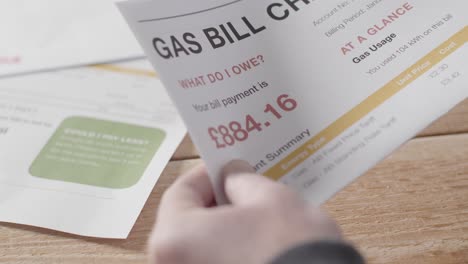Close-Up-Of-Worried-Person-At-Table-Opening-UK-Gas-Energy-Bill