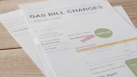 Close-Up-Of-Overdue-UK-Energy-And-Mortgage-Bills-Being-Thrown-Onto-Table