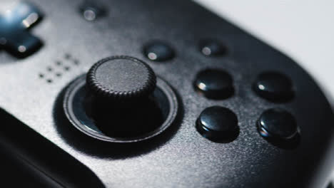 Studio-Close-Up-Of-Video-Game-Controller-Rotating-White-Background-1