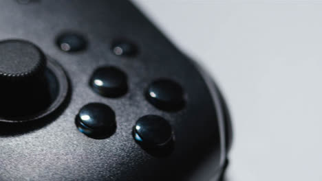 Studio-Close-Up-Of-Video-Game-Controller-Rotating-White-Background-5
