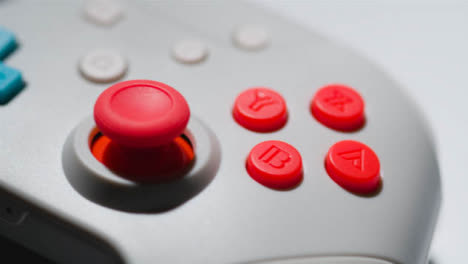 Studio-Close-Up-Of-Video-Game-Controller-Rotating-White-Background-7