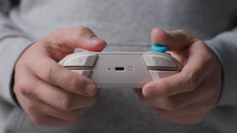 Front-On-Close-Up-Shot-Of-Hands-As-Man-Plays-With-Video-Game-Controller