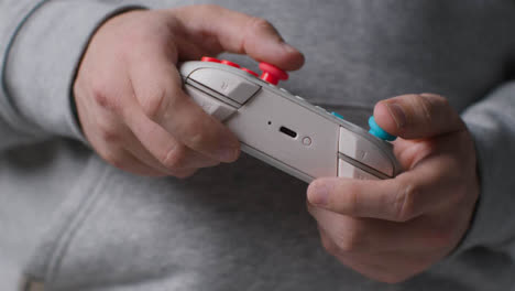 Side-On-Close-Up-Shot-Of-Hands-As-Man-Plays-With-Video-Game-Controller