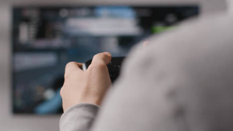 Close-Up-Hands-Man-Playing-Driving-Video-Game-Controller-Screen-Background-3