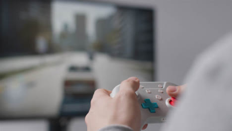 Close-Up-Hands-Man-Playing-Driving-Video-Game-Controller-Screen-Background-5