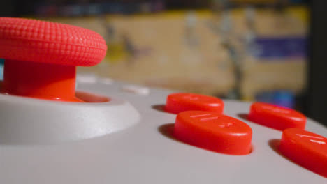 Close-Up-Macro-Video-Game-Controller-Sports-Game-On-Screen-In-Background-3