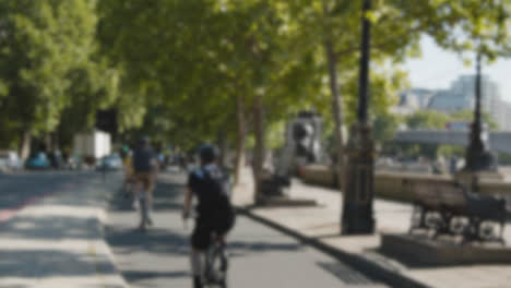 Defocused-Shot-Pedestrians-Cyclists-Busy-Traffic-Commuting-Work-The-Embankment