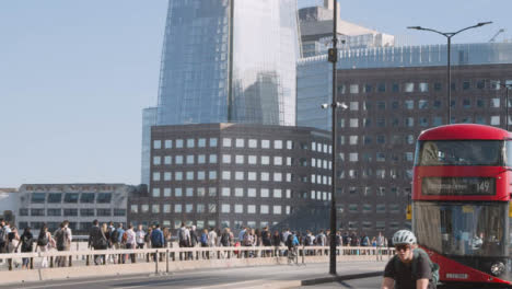 Pedestrians-Cyclists-Commuting-London-Bridge-Office-Buildings-Background