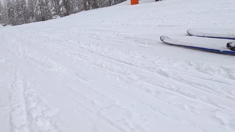Low-Angle-POV-Shot-Of-Skier-Skiing-Down-Snow-Covered-Slope-2