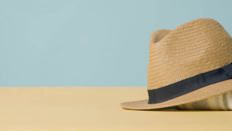 Summer-Holiday-Concept-Of-Sun-Hat-Sunglasses-On-Beach-Towel