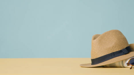 Summer-Holiday-Concept-Of-Sun-Hat-Sunglasses-On-Beach-Towel-1