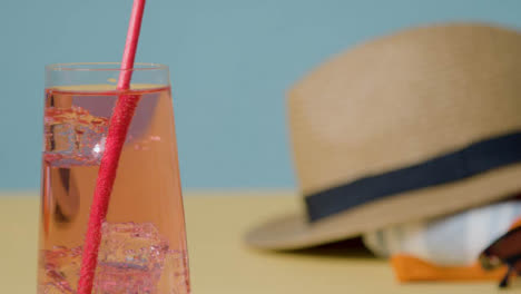 Summer-Holiday-Concept-Of-Cold-Drink-With-Sun-Hat-On-Beach-Towel-3