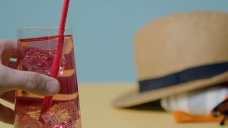 Summer-Holiday-Concept-Of-Cold-Drink-With-Sun-Hat-On-Beach-Towel-5