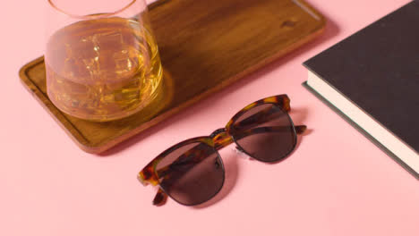 Summer-Holiday-Concept-Of-Sunglasses-Cold-Drink-Book-Tray-On-Pink-Background-2