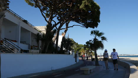 Spain-Cambrils-Path-In-Shadow-With-People-Walking