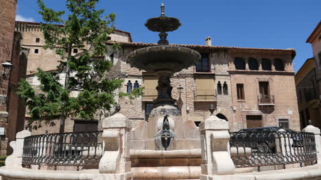 Spain-Mora-De-Rubielos-Fountain-With-Fish-And-Blue-Sky