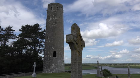 Ireland-Clonmacnoise-Round-Tower-And-High-Cross-In-Shadow