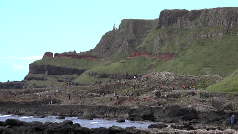 Northern-Ireland-Tourists-Below-Cliffs-At-Giants-Causeway