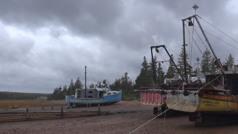Canada-Nova-Scotia-Boats-In-A-Row-Under-Clouds-Pan