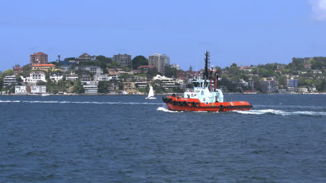 Australia-Sydney-Harbour-With-Tugboat-Passing-Suburb