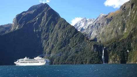 New-Zealand-Milford-Sound-Cruise-Ship-And-Waterfall