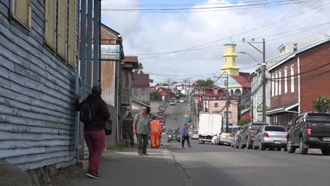 Chile-Chiloe-Chonchi-Zooms-To-Man-By-Street