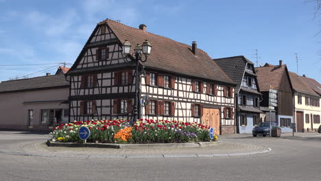 France-Alsace-Car-Passes-Tulips-And-Half-Timbered-House-At-Boofzheim