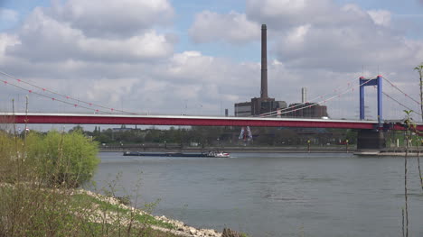 Germany-Duisburg-Barge-Goes-Under-Bridge