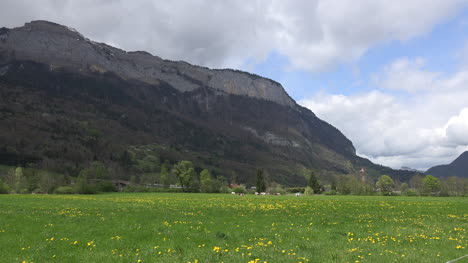 France-Meadow-And-Mountain-With-Clouds