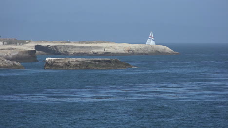 California-Lighthouse-Point-with-sailboat