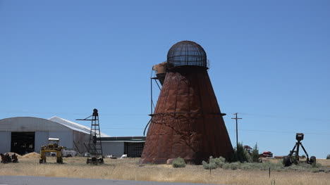 California-rusted-wigwam-burner-with-truck-and-jeep