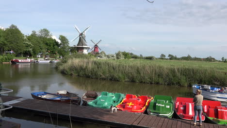 Germany-colorful-boats-and-windmills-at-Greetsiel