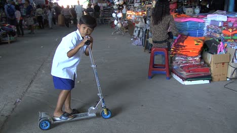 Cambodia-market-boy-on-scooter