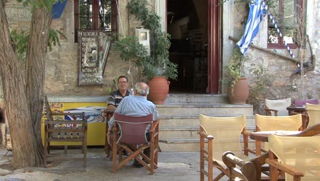 Men-relaxing-in-Mesta-on-Chios