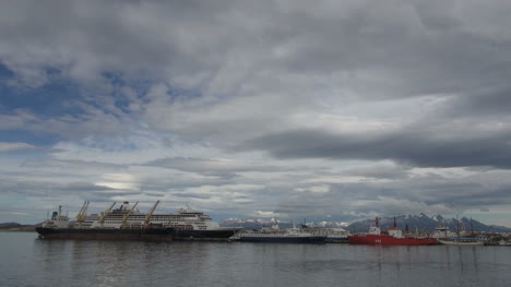 Argentina-Ushuaia-ships-docked-beneath-cloudy-sky