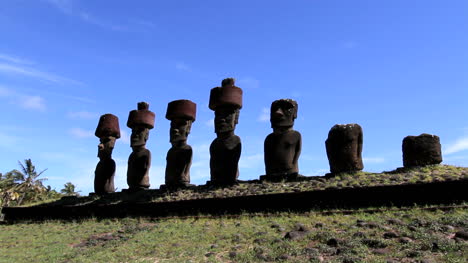 Anakena-Beach-moai-in-a-row-below-a-blue-sky