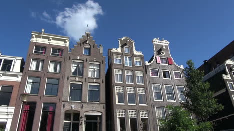 Netherlands-Amsterdam-gabled-houses-pass-by