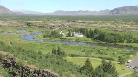 Iceland-Pingvellir-valley-with-stream-and-buildings