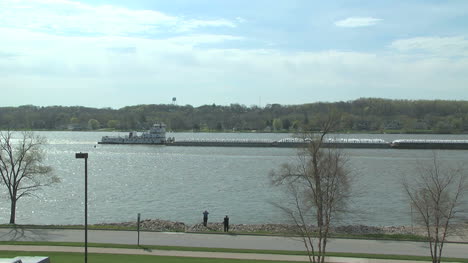 Iowa-Le-Claire-Barge-moves-on-the-Mississippi-River
