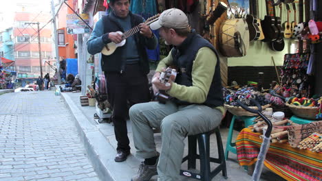 Tourist-playing-a-guitar-in-a-market