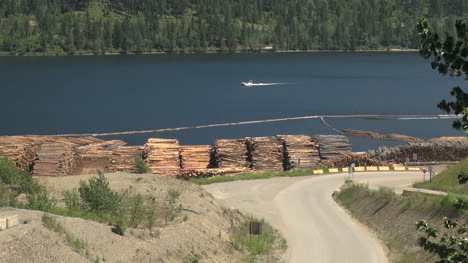 British-Columbia-Adams-Lake-logs-and-boat