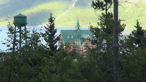 Canada-Alberta-Prince-of-Wales-Hotel-framed-with-trees-Waterton-Lakes-NP
