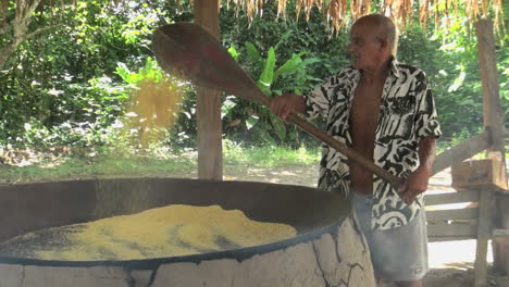 Amazon-village-man-cooking-manioc